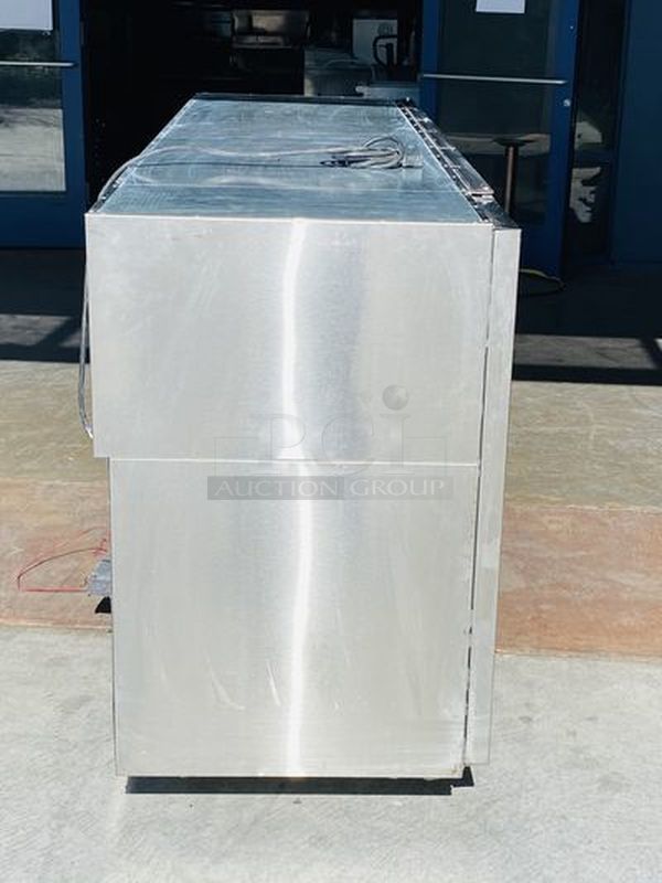 LIKE NEW! Krowne Back Bar. Model BS84L-KNB-LLR 115V, 60Hz, 1Ph, 9A. 35x84x24 Removed from the SLS. Used Briefly

35" high without top, 36" high 
24" front to back depth 
All stainless steel, coved corner interior with LED lighting Digital Thermostat Sideblow refrigeration 
High performance refrigeration system
Expansion valve with 134A refrigerant
Operating range of 30°F - 40°F (Preset at 35°F)
Heavy duty 18-gauge door jambs
NSF epoxy coated durable shelves. One bottom and two adjustable shelves per door.

*Due to EPA Regulations the Freon was removed.  - Image 5 of 9