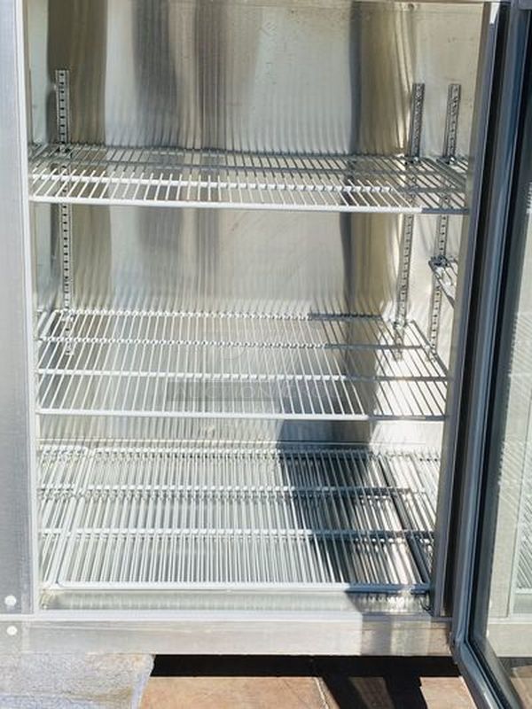 LIKE NEW! Krowne Back Bar. Model BS84L-KNB-LLR 115V, 60Hz, 1Ph, 9A. 35x84x24 Removed from the SLS. Used Briefly

35" high without top, 36" high 
24" front to back depth 
All stainless steel, coved corner interior with LED lighting Digital Thermostat Sideblow refrigeration 
High performance refrigeration system
Expansion valve with 134A refrigerant
Operating range of 30°F - 40°F (Preset at 35°F)
Heavy duty 18-gauge door jambs
NSF epoxy coated durable shelves. One bottom and two adjustable shelves per door.

*Due to EPA Regulations the Freon was removed.  - Image 8 of 9