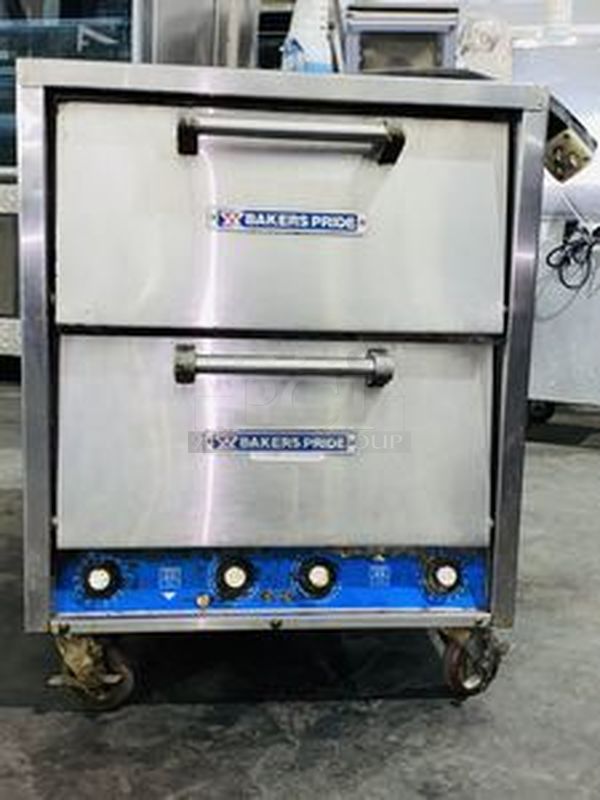 Bakers Pride P-44S Electric Countertop Pizza and Pretzel Oven On Commercial Casters - 208V, 1 Phase, 7200W   26”W x 28 1/2”H x 28”D   Baking Chamber Width 20 3/4 Inches Baking Chamber Depth 20 3/4 Inches Deck Height 3 1/4 Inches  Exterior Material: Stainless Steel Interior Material: Aluminized Steel Number of Decks: 4 Number of Doors: 2 Power Type: Electric Style: Deck Style Temperature Range: 300 - 650 Degrees F - Image 1 of 8
