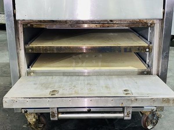Bakers Pride P-44S Electric Countertop Pizza and Pretzel Oven On Commercial Casters - 208V, 1 Phase, 7200W   26”W x 28 1/2”H x 28”D   Baking Chamber Width 20 3/4 Inches Baking Chamber Depth 20 3/4 Inches Deck Height 3 1/4 Inches  Exterior Material: Stainless Steel Interior Material: Aluminized Steel Number of Decks: 4 Number of Doors: 2 Power Type: Electric Style: Deck Style Temperature Range: 300 - 650 Degrees F - Image 2 of 8