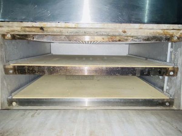 Bakers Pride P-44S Electric Countertop Pizza and Pretzel Oven On Commercial Casters - 208V, 1 Phase, 7200W   26”W x 28 1/2”H x 28”D   Baking Chamber Width 20 3/4 Inches Baking Chamber Depth 20 3/4 Inches Deck Height 3 1/4 Inches  Exterior Material: Stainless Steel Interior Material: Aluminized Steel Number of Decks: 4 Number of Doors: 2 Power Type: Electric Style: Deck Style Temperature Range: 300 - 650 Degrees F - Image 3 of 8