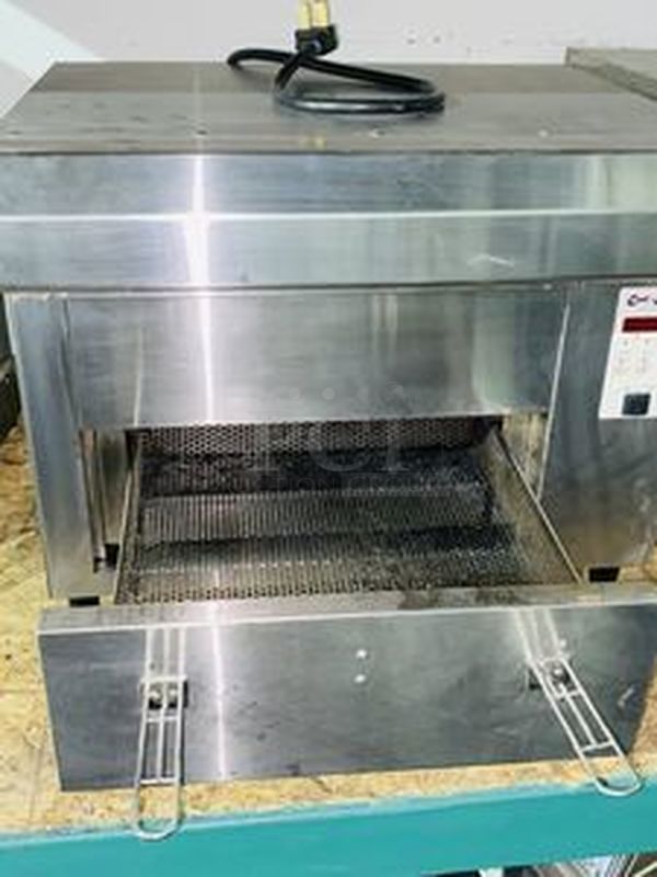 AMAZING! Quik N' Crispy GF5 Greaseless Fryer. Works Like New!   The patented Quik n’ Crispy® Model GF5 uses a combination of forced hot air, radiant heat, and an elevated perforated cooking basket to prepare ovenable frozen foods to the taste and texture as if they were deep-fat fried.   Dimensions: 23-1/2" W x 20" D x 13-1/2" H 208V (29 amp) / 60Hz/ 1 Phase Plug Type: NEMA #6-30R Weight: 175 lbs  Can Stack multiple to save space and increase productivity. Works Like New. - Image 10 of 10