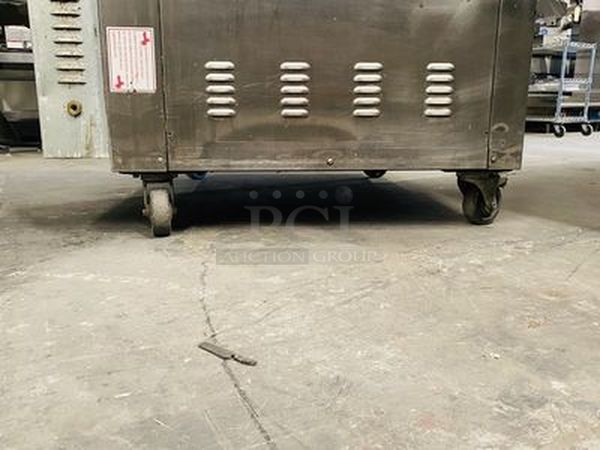 LIKE NEW, Barley Used!! Doyon Baking Equipment JA12SLG 38" Jet Air Gas Dual Convection Oven Model: 12 Full (18"x26")Pans, side loading, reversing fan system, digital temperature controller and timer, steam injection system, full view glass doors, interior light, stainless steel interior & exterior, casters.  Removed From Ceasar's Hotel and Casino  38"W x 72¾"H x 37½"D  120/208 volts 60Hz 3Ph 7A Phases 3 Watts 60 - Image 7 of 9