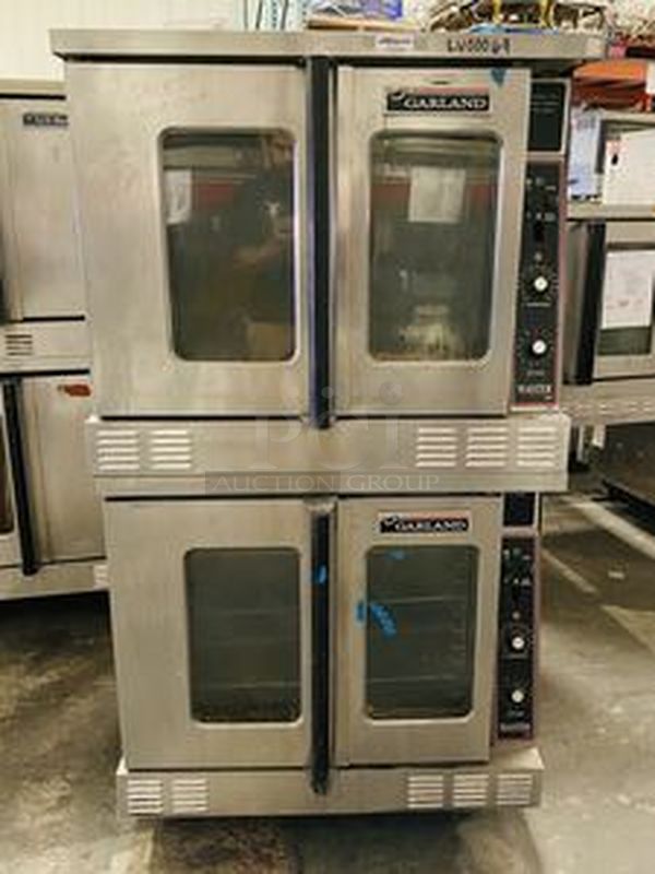 Great Condition! Garland MCO-GS-20S Master Series 200 Natural Gas Double Deck Standard Depth Full Size Convection Oven with Analog Controls - 120,000 BTU. On Commercial Casters.   The  MCO-GS-20S Oven has Master 200 solid state analog controls and a temperature range of 150-500 degrees Fahrenheit.  120V/1Ph.  Width 38 Inches  Depth 41 1/4 Inches Height 70 1/2 Inches Interior Width 29 Inches Interior Depth 24 Inches Interior Height 24 Inches 18 x 26 Pan Capacity 12 Pans Control Type Dial  Power Type Natural Gas - Image 1 of 10