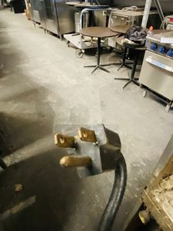 Great Condition! Garland MCO-GS-20S Master Series 200 Natural Gas Double Deck Standard Depth Full Size Convection Oven with Analog Controls - 120,000 BTU. On Commercial Casters.   The  MCO-GS-20S Oven has Master 200 solid state analog controls and a temperature range of 150-500 degrees Fahrenheit.  120V/1Ph.  Width 38 Inches  Depth 41 1/4 Inches Height 70 1/2 Inches Interior Width 29 Inches Interior Depth 24 Inches Interior Height 24 Inches 18 x 26 Pan Capacity 12 Pans Control Type Dial  Power Type Natural Gas - Image 7 of 10