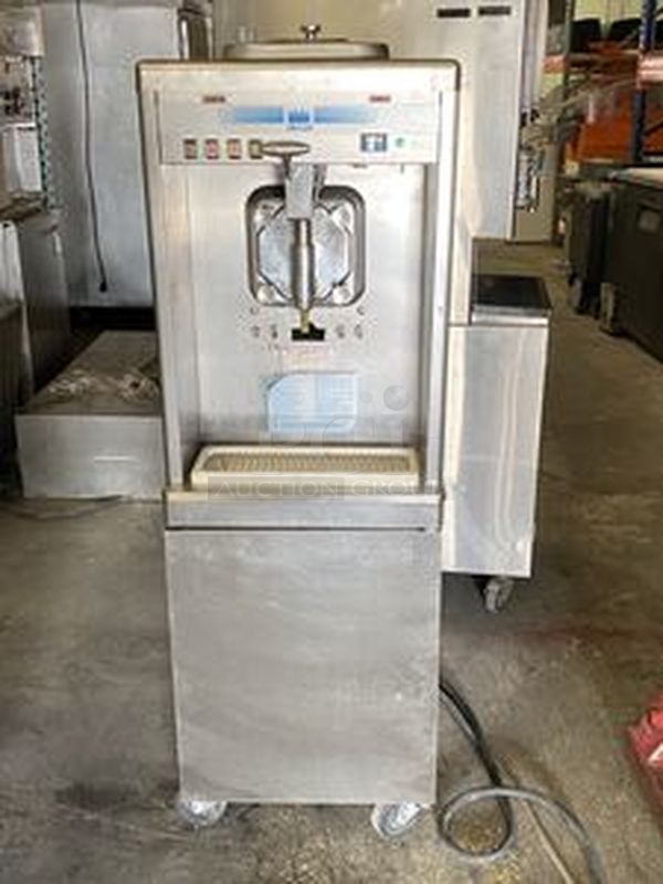 Taylor Model 60-27 Air Cooled Shake Freezer With Four Flavor Options. 208-230V/60Hz/1Ph Air Cooled - 18-7/16x32x59-7/8  Features  Offer four separate shake flavors: chocolate, strawberry, vanilla (unflavored shake mix) and an optional flavor.  Freezing Cylinder: One, 7 quart (6.6 liter).  Mix Hopper: One, 20 quart (18.9 liter). Separate hopper refrigeration (SHR) maintains mix below 41oF (5oC).  Indicator Lights: Add Mix light alerts the operator to add mix. When the Mix Out light flashes, the unit automatically shuts down to prevent damage.  Accurate Consistency Control: Torque control precisely maintains superior shake quality in texture, viscosity and taste.  Shake Syrup System: Shake flavors are selected from push buttons. Self-contained air compressor delivers shake syrup from three, 1 gallon (3.8 liter) syrup tanks located in the lower front compartment.  Automatic Dispensing: Press the desired flavor button, and either raise the draw handle or use the foot pedal for hands free d - Image 1 of 10