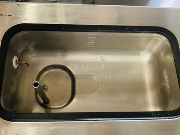 Taylor Model 60-27 Air Cooled Shake Freezer With Four Flavor Options. 208-230V/60Hz/1Ph Air Cooled - 18-7/16x32x59-7/8  Features  Offer four separate shake flavors: chocolate, strawberry, vanilla (unflavored shake mix) and an optional flavor.  Freezing Cylinder: One, 7 quart (6.6 liter).  Mix Hopper: One, 20 quart (18.9 liter). Separate hopper refrigeration (SHR) maintains mix below 41oF (5oC).  Indicator Lights: Add Mix light alerts the operator to add mix. When the Mix Out light flashes, the unit automatically shuts down to prevent damage.  Accurate Consistency Control: Torque control precisely maintains superior shake quality in texture, viscosity and taste.  Shake Syrup System: Shake flavors are selected from push buttons. Self-contained air compressor delivers shake syrup from three, 1 gallon (3.8 liter) syrup tanks located in the lower front compartment.  Automatic Dispensing: Press the desired flavor button, and either raise the draw handle or use the foot pedal for hands free d - Image 7 of 10