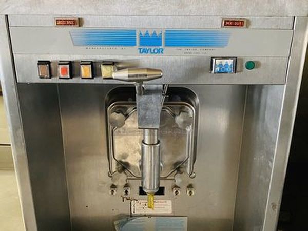 Taylor Model 60-27 Air Cooled Shake Freezer With Four Flavor Options. 208-230V/60Hz/1Ph Air Cooled - 18-7/16x32x59-7/8  Features  Offer four separate shake flavors: chocolate, strawberry, vanilla (unflavored shake mix) and an optional flavor.  Freezing Cylinder: One, 7 quart (6.6 liter).  Mix Hopper: One, 20 quart (18.9 liter). Separate hopper refrigeration (SHR) maintains mix below 41oF (5oC).  Indicator Lights: Add Mix light alerts the operator to add mix. When the Mix Out light flashes, the unit automatically shuts down to prevent damage.  Accurate Consistency Control: Torque control precisely maintains superior shake quality in texture, viscosity and taste.  Shake Syrup System: Shake flavors are selected from push buttons. Self-contained air compressor delivers shake syrup from three, 1 gallon (3.8 liter) syrup tanks located in the lower front compartment.  Automatic Dispensing: Press the desired flavor button, and either raise the draw handle or use the foot pedal for hands free d - Image 8 of 10