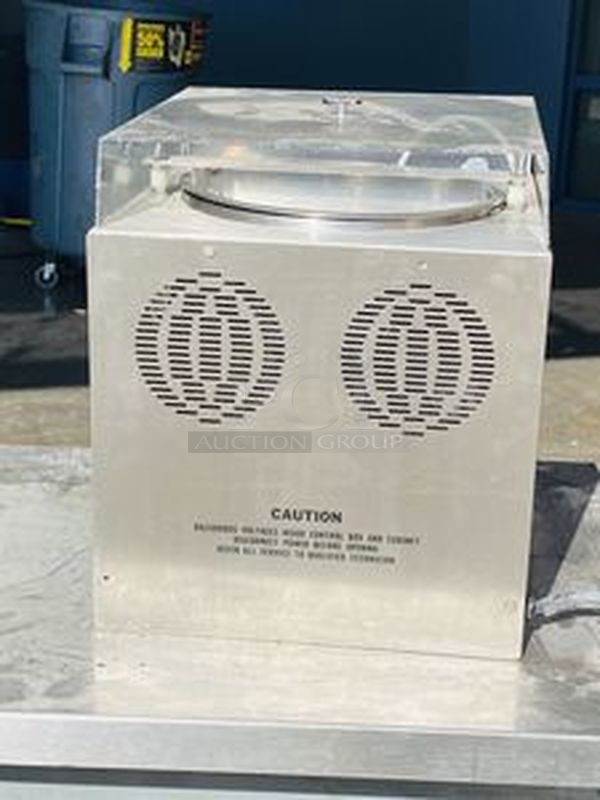 Hilliard Chocolate System Model: Little Dipper
Automatic Chocolate Melting and Tempering Machine. 

Capacity: 25 lbs. (12 kg.) per day 

Size: 16" x 16" x 17" (41 x 41 x 43 cm) 

Tested. Working. 

Electrical Requirements: 120 volts, 400 watts. Units can be supplied to meet other electrical requirements. - Image 1 of 6