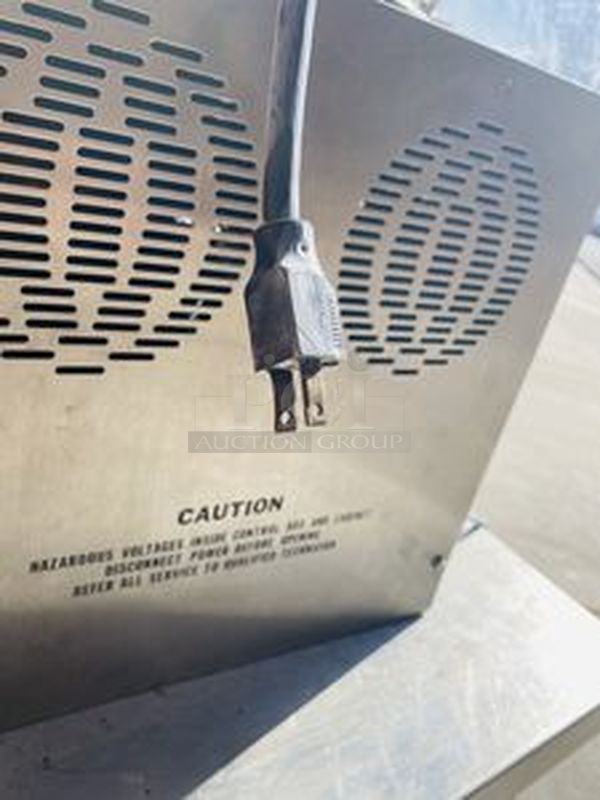 Hilliard Chocolate System Model: Little Dipper
Automatic Chocolate Melting and Tempering Machine. 

Capacity: 25 lbs. (12 kg.) per day 

Size: 16" x 16" x 17" (41 x 41 x 43 cm) 

Tested. Working. 

Electrical Requirements: 120 volts, 400 watts. Units can be supplied to meet other electrical requirements. - Image 5 of 6