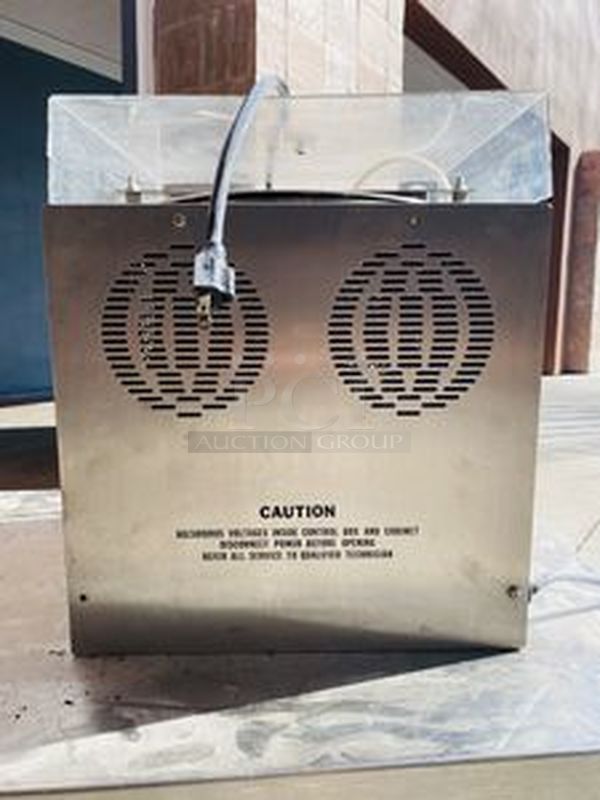 Hilliard Chocolate System Model: Little Dipper
Automatic Chocolate Melting and Tempering Machine. 

Capacity: 25 lbs. (12 kg.) per day 

Size: 16" x 16" x 17" (41 x 41 x 43 cm) 

Tested. Working. 

Electrical Requirements: 120 volts, 400 watts. Units can be supplied to meet other electrical requirements. - Image 6 of 6