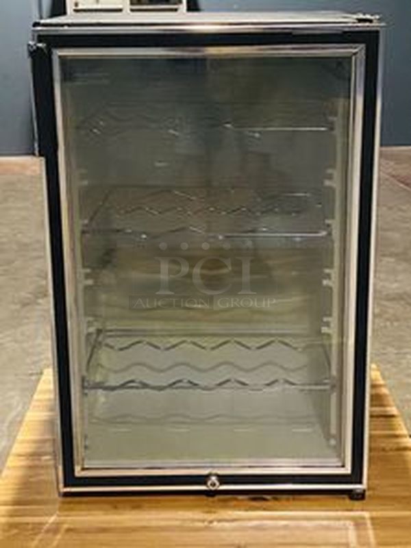 WORKS Like NEW! Jenn Air Model: WCG-H9 The Wine Cellar. Single Glass Door, Cold Plate Technology - Quickly and Silently Gets Down To and Holds Your Desired Temperature.  115 Volts, 2V, 60Hz This Model Can Hold up To 5 Shelves!  - Image 1 of 8