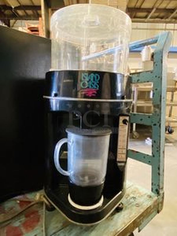 AWESOME! Island Oasis SB-3X Ice Shaver-Blender Has an Output of 15 Gallons/Hr. 1-16oz. drink/30sec. Holds Up To 10Lbs of Ice 115V Power / 6.7 AMP Grounded Outlet.   Shaver-Blender/9sec. Cycle Time Portion Control Ice 1,2, or 3 Drinks  14” wide x 16” deep x 27” high. Weighs approximately 60 pounds - Image 1 of 6