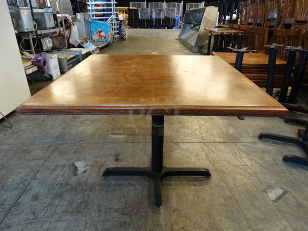 Wood Pattern Tabletop and Black Metal Table Base. Comes Disassembled. Stock Picture - Cosmetic Condition May Vary. 36x36x30