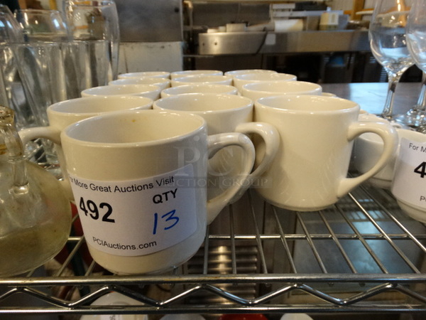 13 White Ceramic Mugs. 5x3.5x3.5. 13 Times Your Bid!