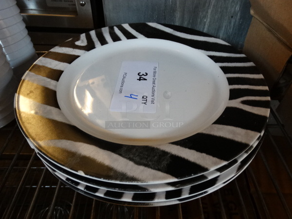 4 White Ceramic Plate w/ Black and White Patterned Rim. 11x11x1. 4 Times Your Bid!