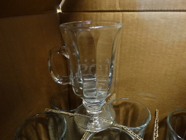 12 BRAND NEW IN BOX! Glass Footed Mugs. 4x3x5.5. 12 Times Your Bid!