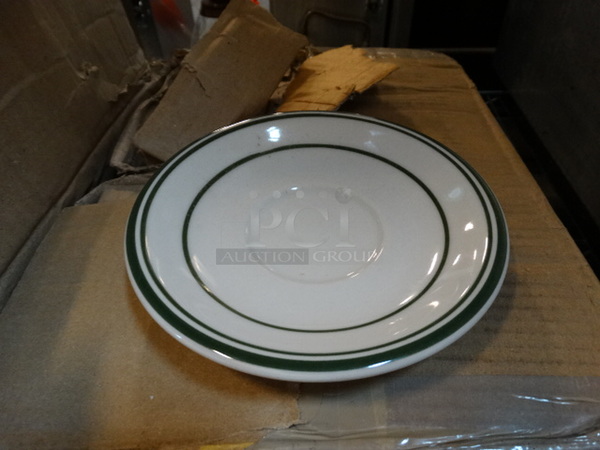 33 BRAND NEW IN BOX! White Ceramic Saucers w/ Green Lines on Rim. 6x6x1. 33 Times Your Bid!
