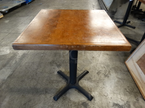 Wood Pattern Tabletop and Black Metal Table Base. Comes Disassembled. Stock Picture - Cosmetic Condition May Vary. 24x24x30
