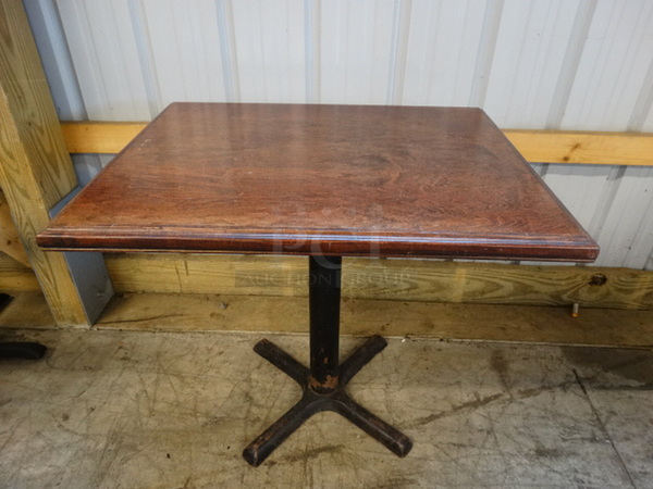 Wood Pattern Tabletop and Black Metal Table Base. Comes Disassembled. Stock Picture - Cosmetic Condition May Vary. 30x24x30