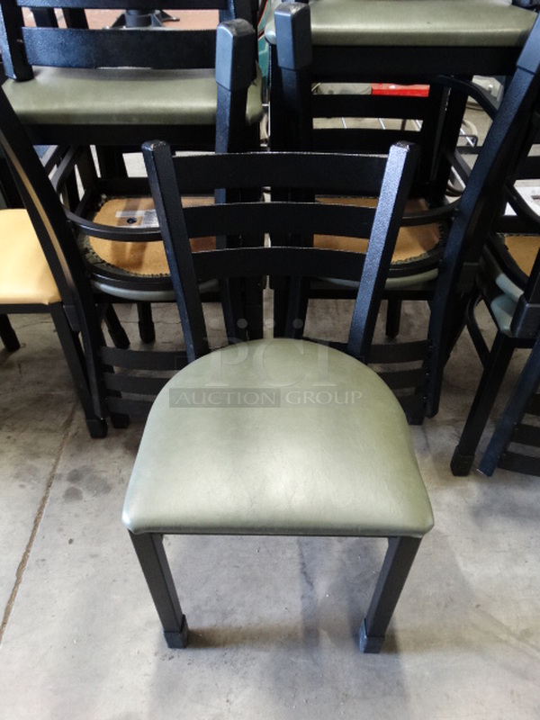 5 Black Metal Dining Chairs w/ Green Seat Cushion. Stock Picture - Cosmetic Condition May Vary. 17x16x33. 5 Times Your Bid!