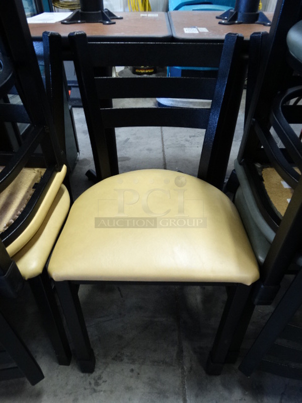 4 Black Metal Dining Chairs w/ Yellow Seat Cushion. Stock Picture - Cosmetic Condition May Vary. 17x16x33. 4 Times Your Bid!