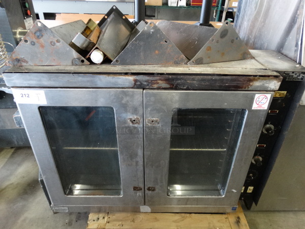 Model T-88-RB Stainless Steel Commercial Gas Powered Full Size Convection Oven w/ View Through Doors, Metal Oven Rack, Thermostatic Controls. Comes w/ Door Handles and 4 Metal Legs That Are Not Attached. 40x30x28