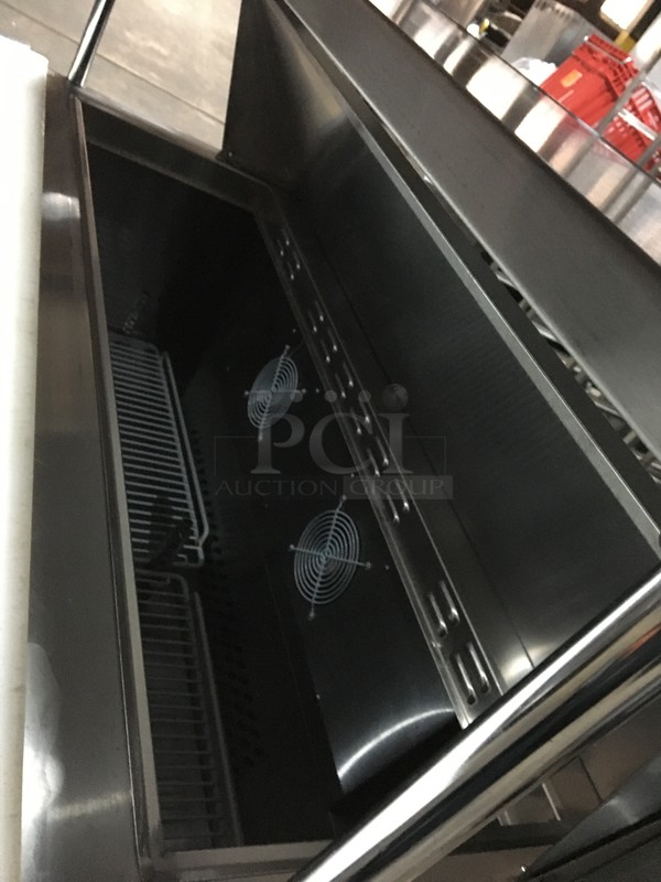 Atosa Commercial Refrigerated Sandwich Prep Table! With 2 Door Underneath Storage Space! With Poly Coated Racks! With Commercial Cutting Board! With Overhead Serving Shelf! All Stainless Steel! Model MSF8302GR Serial MSF8302GRAUS100317042600C40036! 115V 1Phase! On Commercial Casters! - Image 9 of 12