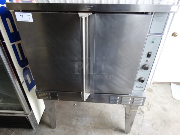 SWEET! Garland SunFire Stainless Steel Commercial Gas Powered Full Size Convection Oven w/ Solid Doors, Metal Racks and Thermostatic Controls on Metal Legs. 38x44x60 - Image 1 of 7