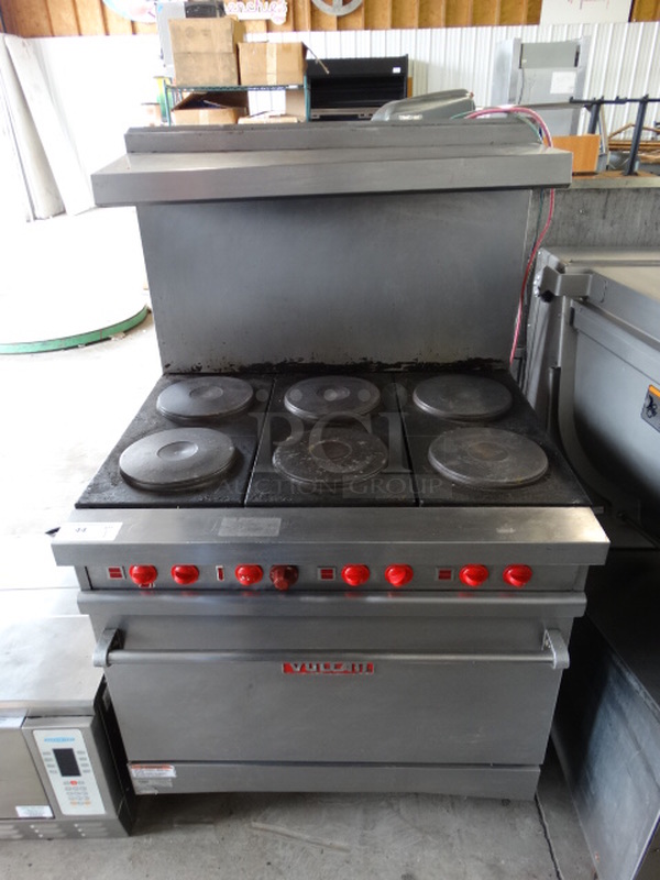 WOW! Vulcan Stainless Steel Commercial Electric Powered 6 Burner Hot Plate Range w/ Oven and Stainless Steel Overshelf on Commercial Casters. 36x30x60 - Image 1 of 7