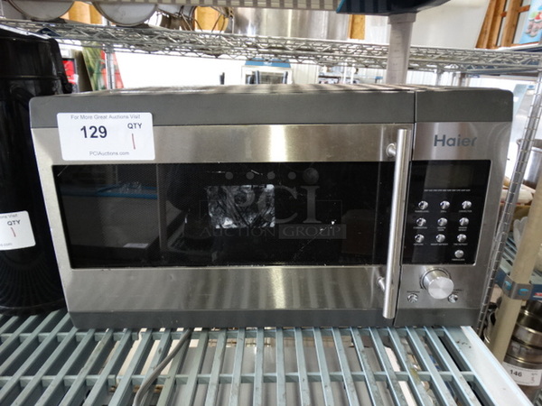 Haier Chrome Finish Countertop Microwave. 20x14x12 - Image 1 of 5