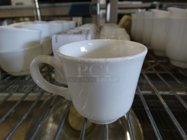 12 White Ceramic Mugs. 3.5x2.75x2.5. 12 Times Your Bid!