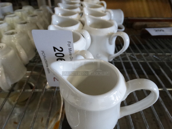 12 White Ceramic Pitchers. 4.5x3x4. 12 Times Your Bid! - Image 3 of 4