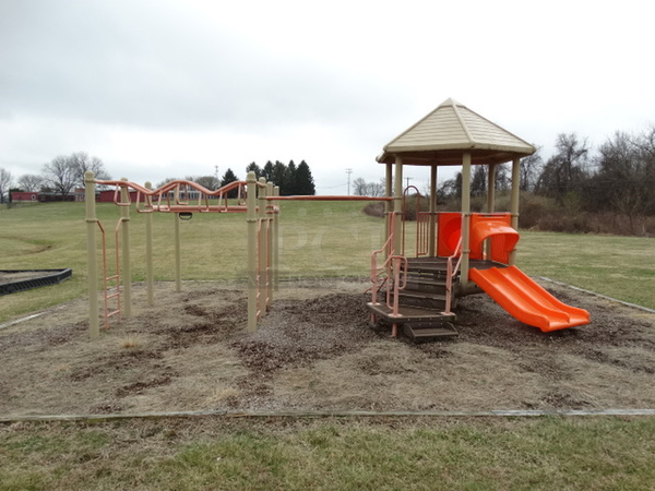 Tan and Orange Metal Playground Unit w/ 2 Slides, Stairs and Monkey Bars. BUYER MUST REMOVE. Item Is Located In Coatesville, PA - Winner Will Have Up To 2 Weeks To Remove. Address Will Be Given To the Winning Bidder After They Provide a Certificate of Insurance - Image 3 of 12