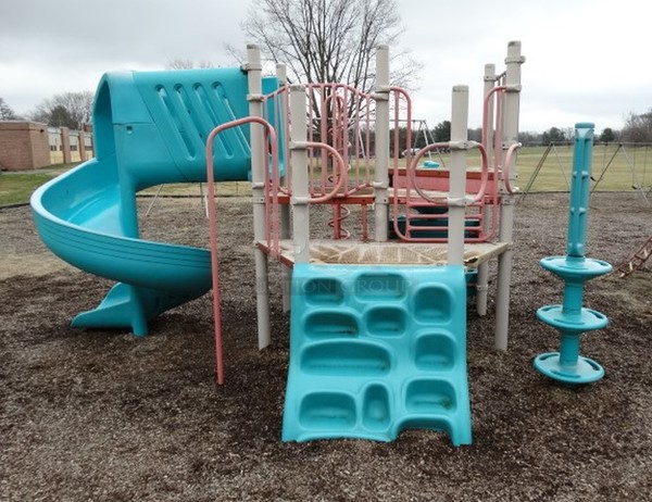 Gray, Blue and Orange Metal Playground Unit w/ Spiral Slide and 5 Various Climbing Entrances. BUYER MUST REMOVE. Item Is Located In Coatesville, PA - Winner Will Have Up To 2 Weeks To Remove. Address Will Be Given To the Winning Bidder After They Provide a Certificate of Insurance