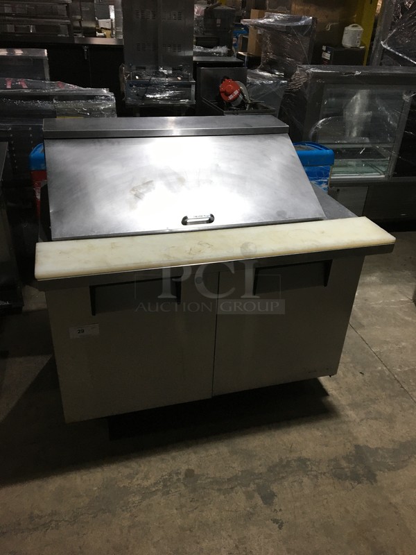 True Commercial Refrigerated Sandwich/Salad Prep Table! With 2 Doors Underneath Storage Space! With Poly Coated Racks! With Commercial Cutting Board! All Stainless Steel! Model TSSU4818MB Serial 7014048! 115V 1Phase! On Commercial Casters! 