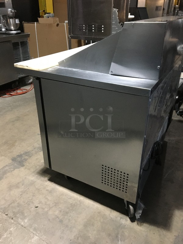 True Commercial Refrigerated Sandwich/Salad Prep Table! With 2 Doors Underneath Storage Space! With Poly Coated Racks! With Commercial Cutting Board! All Stainless Steel! Model TSSU4818MB Serial 7014048! 115V 1Phase! On Commercial Casters!  - Image 3 of 11
