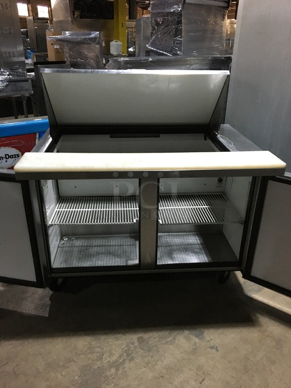 True Commercial Refrigerated Sandwich/Salad Prep Table! With 2 Doors Underneath Storage Space! With Poly Coated Racks! With Commercial Cutting Board! All Stainless Steel! Model TSSU4818MB Serial 7014048! 115V 1Phase! On Commercial Casters!  - Image 5 of 11