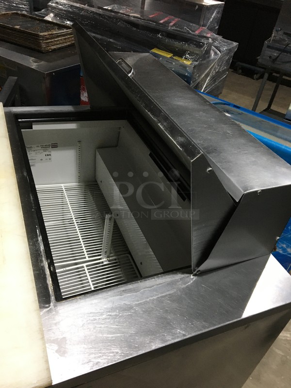 True Commercial Refrigerated Sandwich/Salad Prep Table! With 2 Doors Underneath Storage Space! With Poly Coated Racks! With Commercial Cutting Board! All Stainless Steel! Model TSSU4818MB Serial 7014048! 115V 1Phase! On Commercial Casters!  - Image 7 of 11