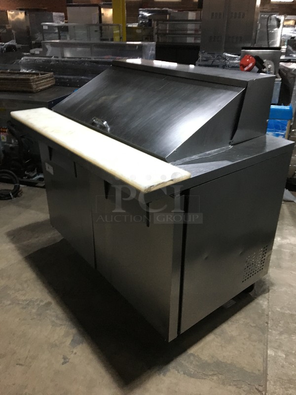 True Commercial Refrigerated Sandwich/Salad Prep Table! With 2 Doors Underneath Storage Space! With Poly Coated Racks! With Commercial Cutting Board! All Stainless Steel! Model TSSU4818MB Serial 7014048! 115V 1Phase! On Commercial Casters!  - Image 10 of 11