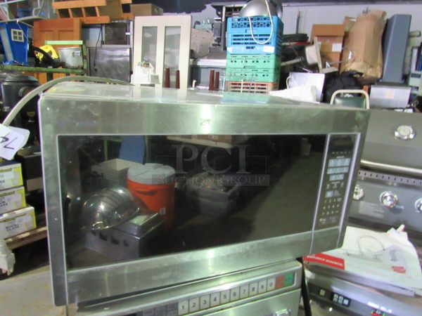 One Stainless Steel Sharp Microwave. 120 Volt. Model# R-5512M. 23X17X13. Working!