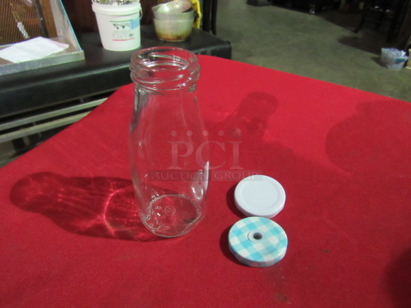 NEW One Lot Of 9-11oz Milk Bottles With 2 Tops Each.