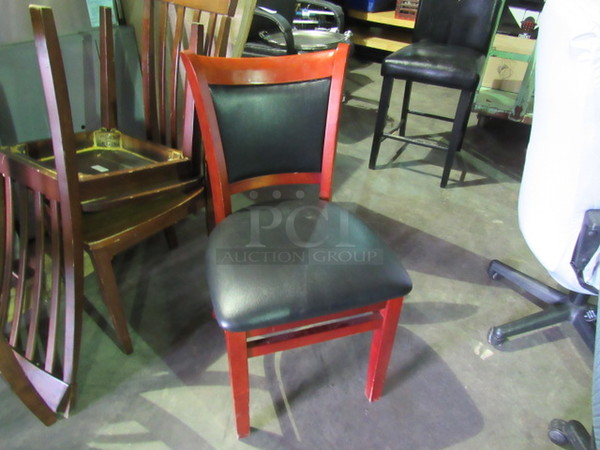 One Wooden Chair With Brown Cushioned Seat And Back.