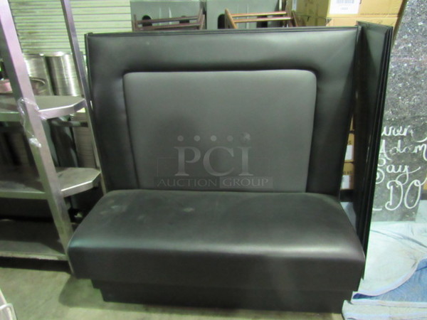 One Single Sided Booth With Black Cushioned Seat And Back. 48X22X48