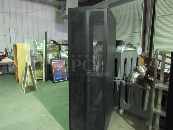 One Media Storage Cabinet With 2 Doors On Casters. 24X42X81