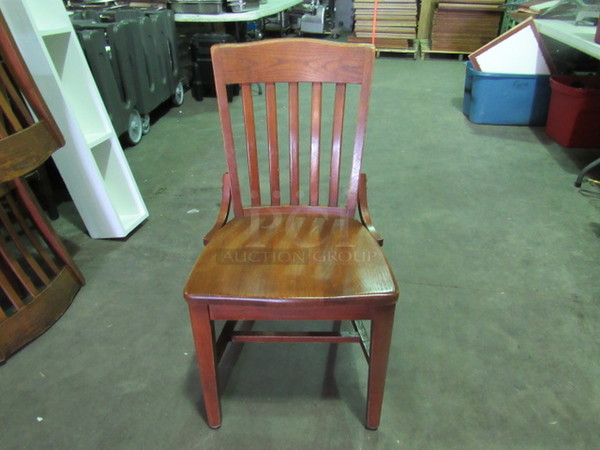 Wooden School House Chair In A Walnut Finish. 4XBID.