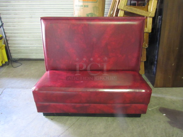 One Double Sided Booth With Red/Black Swirl Cushioned Seat And Back. 48X44X43