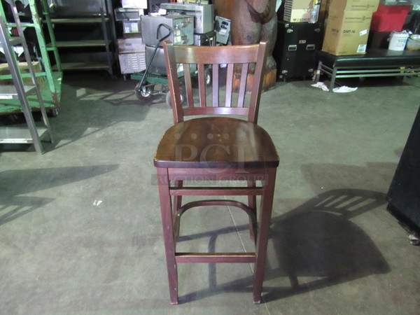 Wooden Bar Height Chair In A Dark Finish With Footrest. 2XBID.