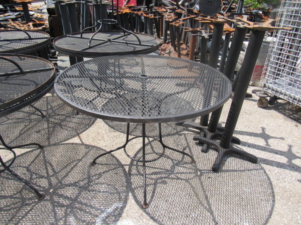 One Round Black Metal Patio Table With Umbrella Hole. 41X29X29