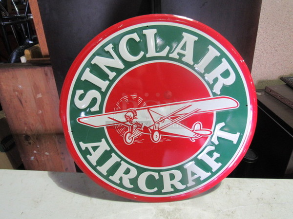 One 23.5 Inch Round Sinclair Air Craft Tin Sign.